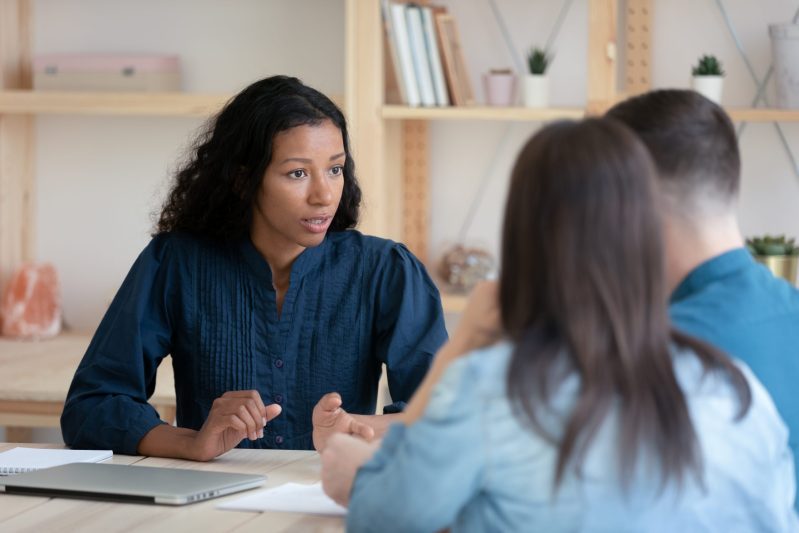 An agent talking with clients